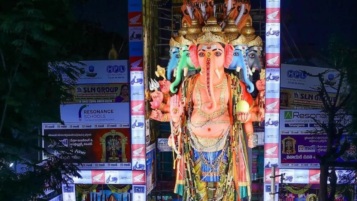 Large crowd of devotees waiting in line to view the 69-foot tall Panchamukha Sankatahara Maha Ganapati idol at the Khairatabad pandal in Hyderabad.